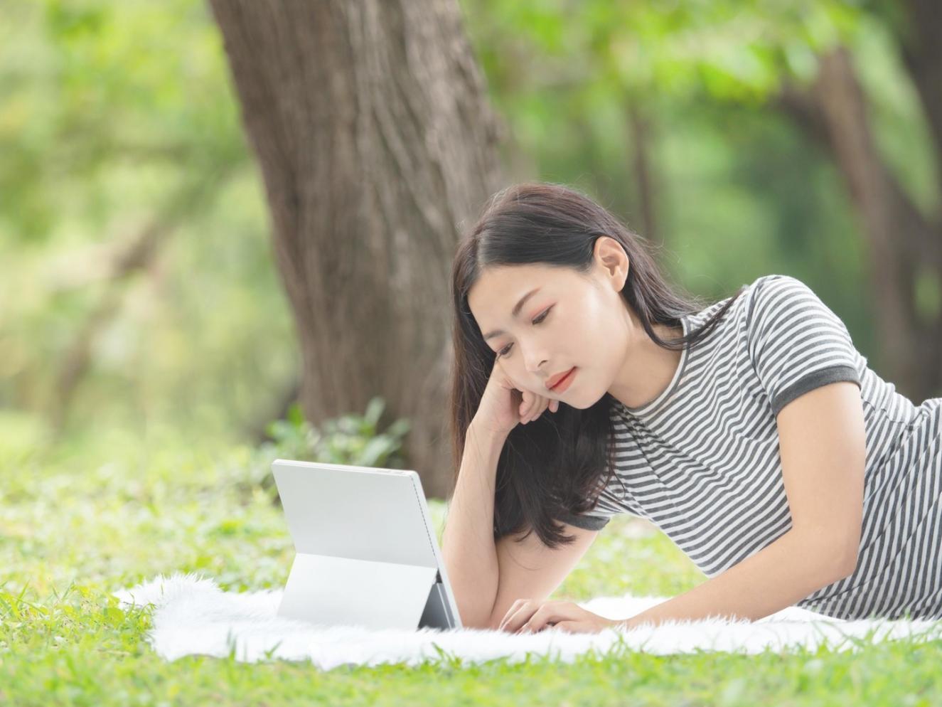 Instructor providing feedback on budget analysis project